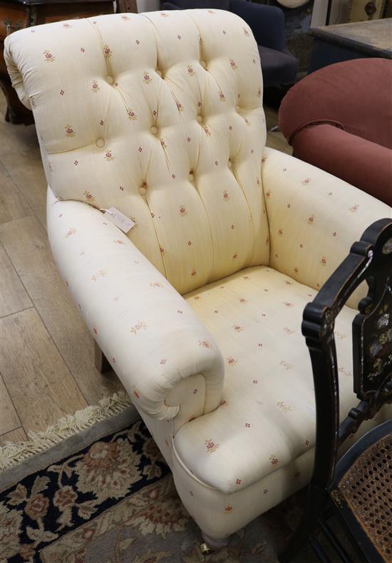 A Victorian upholstered buttonback armchair